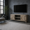 Loft living room | Gray-washed barn-door TV stand below a wall-mounted television in a charcoal loft