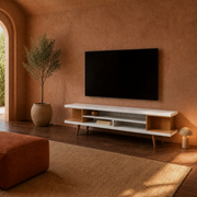 Terracotta room | White and maple open-shelf TV stand below a blank wall TV in a clay-toned room