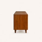 Studio | right side profile of the mahogany cherry TV stand showing the full depth, solid side panel, top, and tapered legs