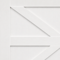 Material | close-up of the painted wood grain and X-brace joinery on a door panel