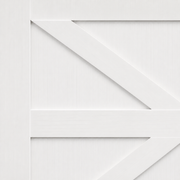 Material | close-up of the painted wood grain and X-brace joinery on a door panel