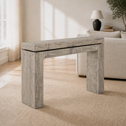 Living room angle | Weathered Wheat solid-pine console table from a three-quarter view with its thick top and block legs
