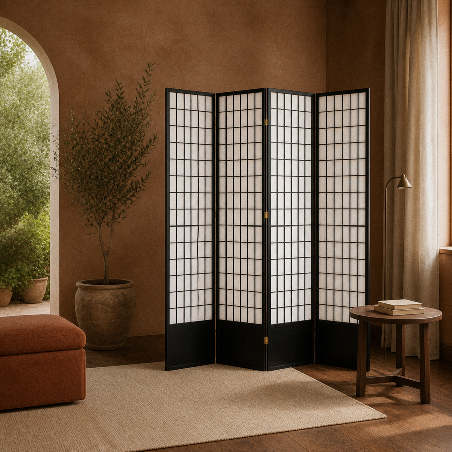Terracotta room | black four-panel divider beside an arched garden opening, olive tree, and rust ottoman