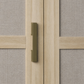 Pull close-up | dark antique-brass rectangular bar pull between pale oak door frames and woven linen panels