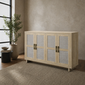 Warm room angle | pale natural oak four-door sideboard from a right three-quarter beside a black-framed window