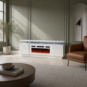 In a room | sage-green paneled room with the high-gloss white fireplace TV stand, leather chair, coffee table, window and blue-lit media bay