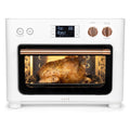 In Use | Air fry basket with fries inside the oven, glowing heating elements visible through the glass door