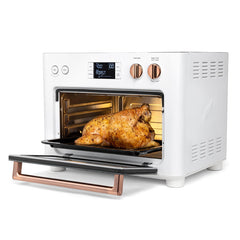 Interior | Three-quarter view with the door open, the brushed copper handle and a roast chicken on the rack