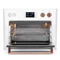 Angle | Side view of the oven on a white countertop with the kitchen in the background