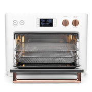 Angle | Side view of the oven on a white countertop with the kitchen in the background