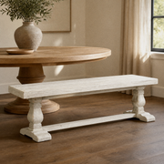 In a room | the bench in a warm plaster dining room, low golden late-afternoon sidelight from the right; table is styling only