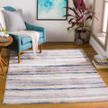 Reading chair | the rug shown by a teal reading chair and side table