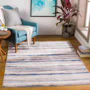 Reading chair | the rug shown by a teal reading chair and side table
