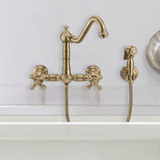 Wall Mount Kitchen Faucet with Swivel Spout and Side Spray in Antique Brass