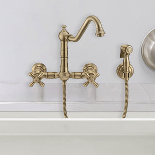 Wall Mount Kitchen Faucet with Swivel Spout and Side Spray in Antique Brass
