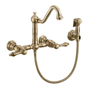 Wall Mount Kitchen Faucet with Swivel Spout and Side Spray in Antique Brass