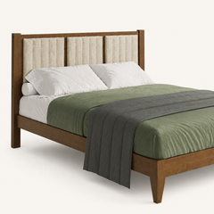 Detail | Close view of the vertical channel-tufted headboard, wood posts, bedding, and front rail