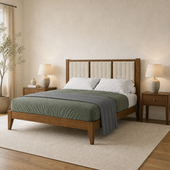 Room 1 angle | Three-quarter bedroom view of the walnut wood frame, channel-tufted headboard, tapered legs, and layered bedding
