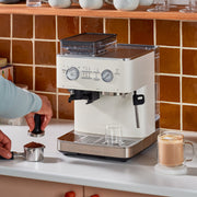Angle | KitchenAid KES6551 espresso machine three-quarter view on kitchen counter showing control panel