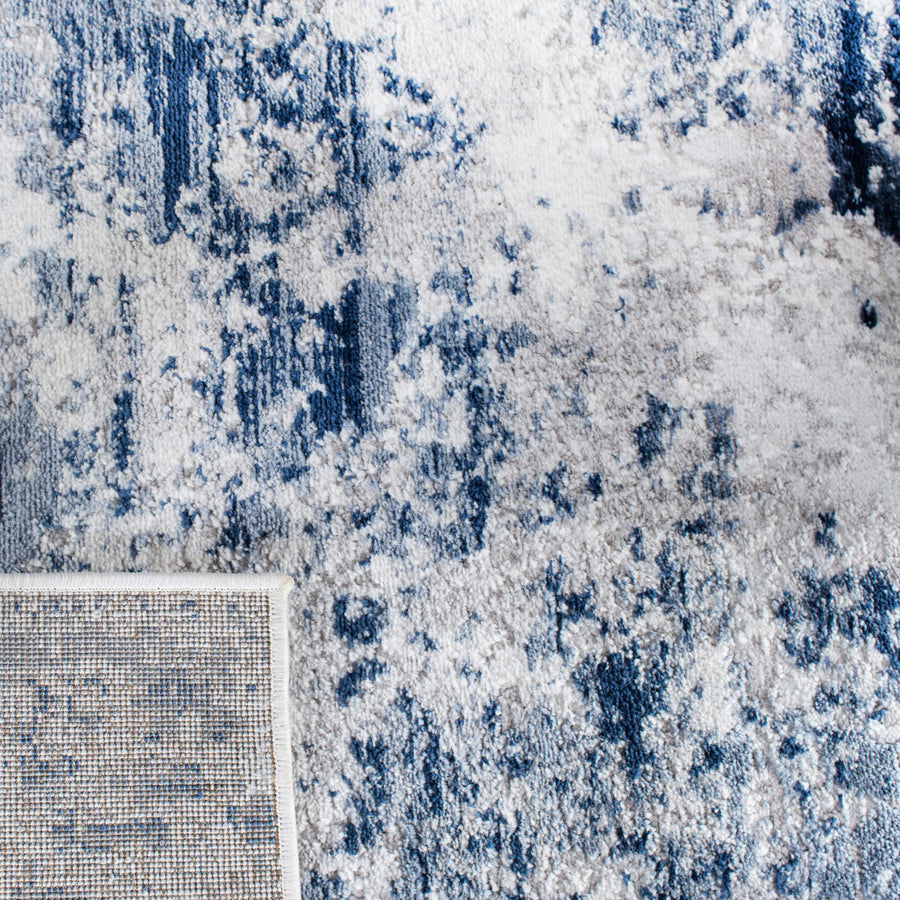 Pile close up | the abstract pattern up close with a folded edge showing the woven backing