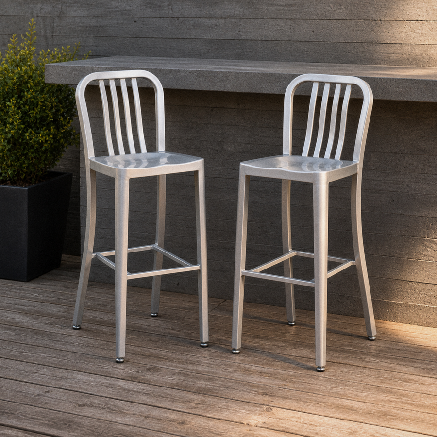In a room | both stools at an outdoor counter on a redwood deck, boxwood planter alongside