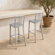 Set of 2 | both silver slatted bar stools together on the terrace, elevated angle