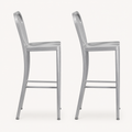 Profile | both stools in true side profile on paper ground, staggered so each is fully visible