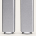 Texture | macro of the brushed silver powder-coated finish on both stools' front legs