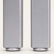 Texture | macro of the brushed silver powder-coated finish on both stools' front legs