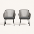 Front | two gray open-back wicker dining armchairs with single gray seat cushions on clean studio ground