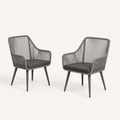 Three-quarter | two gray open-back wicker dining armchairs showing wrapped rails, open backs, and tapered legs on clean studio ground