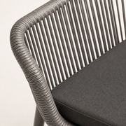 Close view | gray polyethylene-wicker rail wrap, vertical strands, and gray seat-cushion texture on one armchair