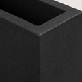 Texture close-up | fine sand-cast charcoal-black composite texture at the planter rim and corner