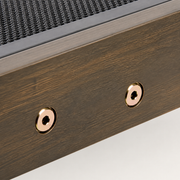 Fastener close-up | round brass-colored rail fasteners in gray-washed acacia