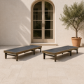 In scale | two flat chaise lounges beside a full-height patio doorway