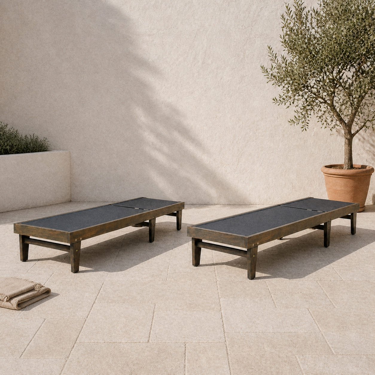Terrace | two gray-washed acacia mesh chaise lounges on pale limestone