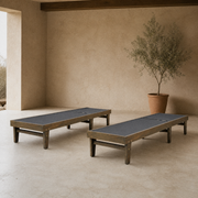 Veranda | two separate flat mesh chaise lounges under a covered adobe patio