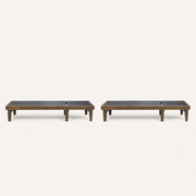 Studio front | two flat charcoal mesh chaise lounges with gray-washed acacia frames
