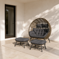 Scale | Complete double egg chair set beside an uncropped full-height patio doorway