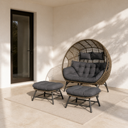 Scale | Complete double egg chair set beside an uncropped full-height patio doorway