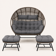 Studio front | Straight-on view of the complete double egg chair and two ottomans with charcoal-gray cushions