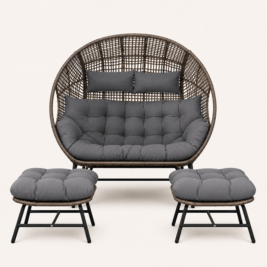 Studio front | Straight-on view of the complete double egg chair and two ottomans with charcoal-gray cushions