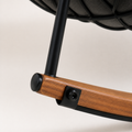 Hardware | close-up of the warm wood-grain metal runner, black leg bracket and bolt