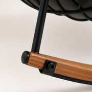 Hardware | close-up of the warm wood-grain metal runner, black leg bracket and bolt