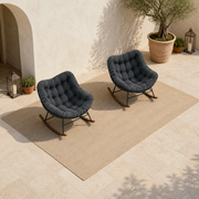 Second courtyard angle showing the complete pair of matching rocking chairs