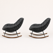 Side | right-side rear studio profile of the two rocking chairs, showing the black wire shells and curved runners