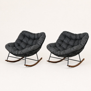 Studio | three-quarter studio view of both dark gray cushioned rocking chairs, with the wire shells and runner profiles visible