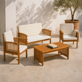 Low three-quarter limestone courtyard view showing the loveseat, two chairs, and coffee table together