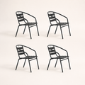 Side | four black stacking patio armchairs shown in left-side profile on a clean studio background