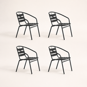 Side | four black stacking patio armchairs shown in left-side profile on a clean studio background